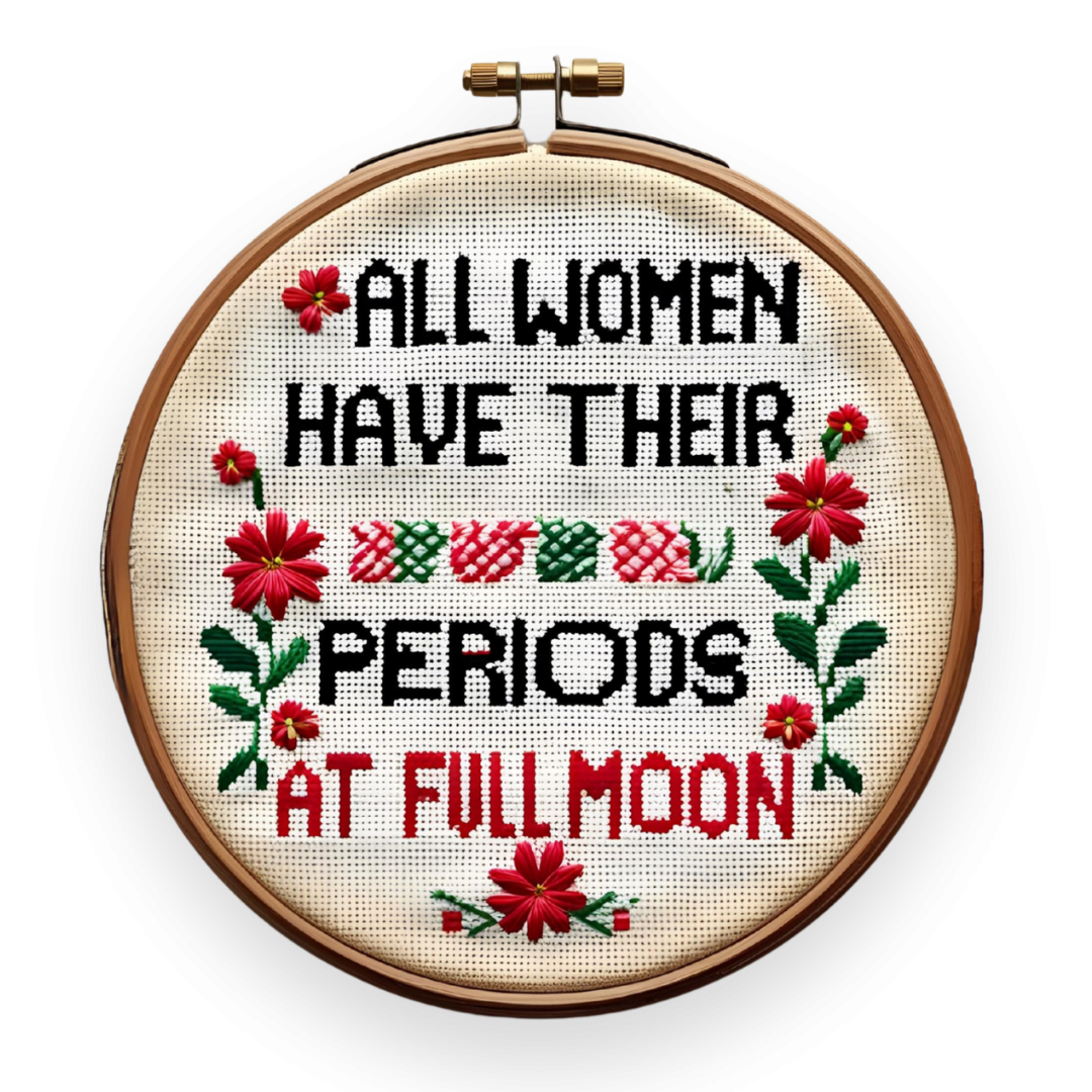 Stickrahmen in altertümlichen Design mit Blumen und den Worten "all wpomen have their periods at full moon"